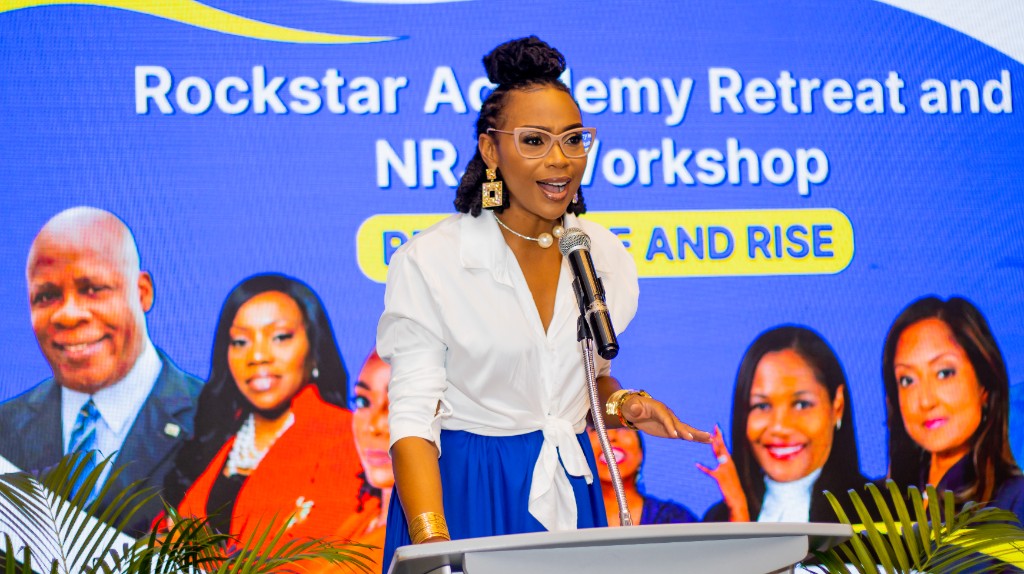 Krystal hosting the Rockstar Academy Retreat and workshop on stage.