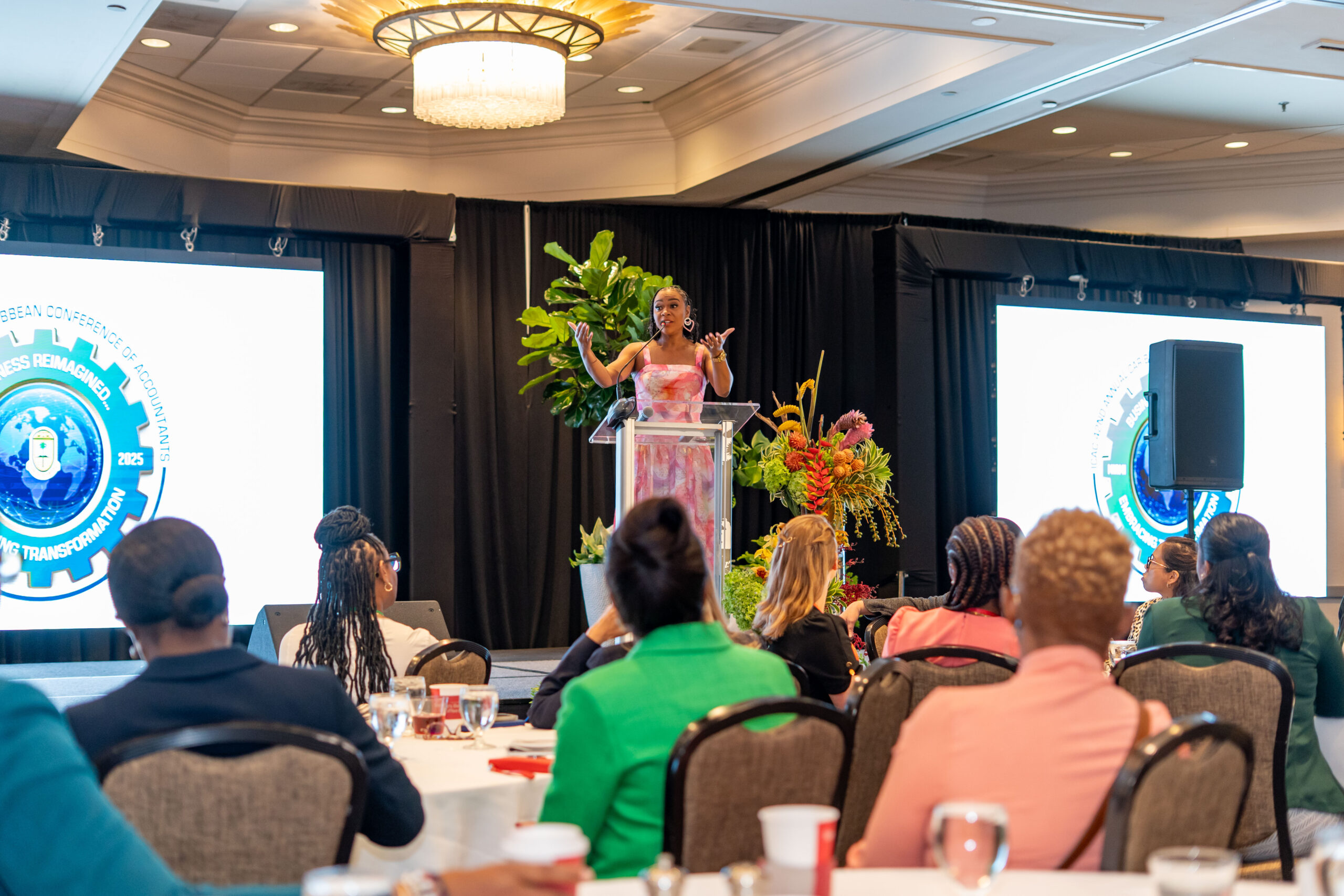 Krystal Tomlinson speaking at podium